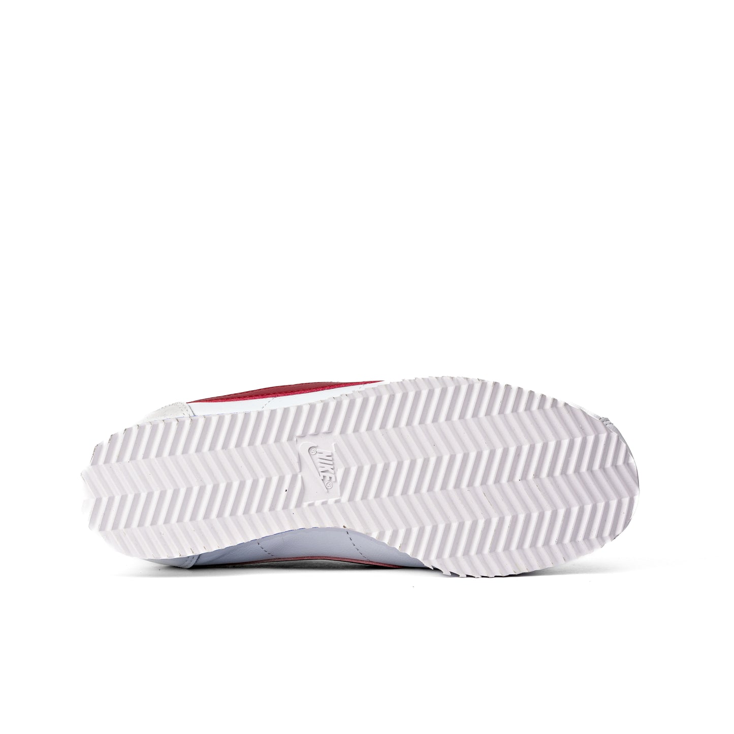 Cortez Forrest Gump sneakers, featuring a white leather upper and signature red swoosh
