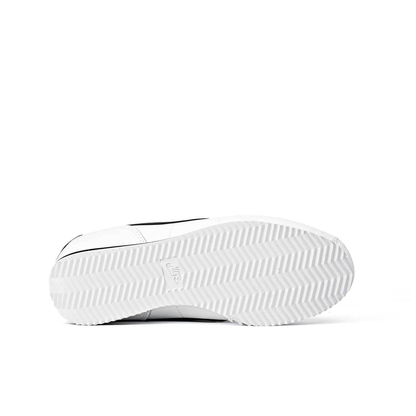 Cortez shoes featuring a classic white leather upper with a contrasting black Swoosh logo