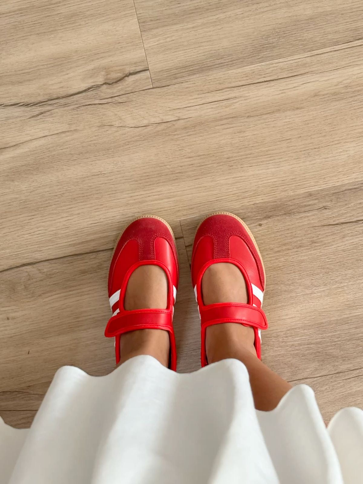 Adidas Samba Jane sneakers in a striking red colorway featuring a hook-and-loop