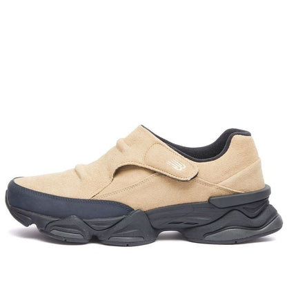 New Balance 8040 slip-on sneakers feature a suede upper in an incense and sandstone
