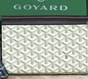 Goyard Chypre wallet on strap featuring the iconic chevron Goyardine coated canvas and a matching detachable small pouch