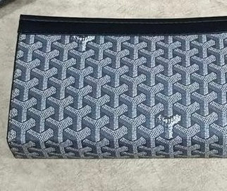 Goyard Chypre wallet on strap featuring the iconic chevron Goyardine coated canvas and a matching detachable small pouch