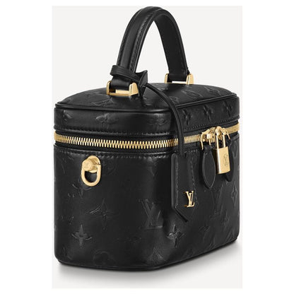 Louis Vuitton Vanity PM crafted in the iconic Monogram coated canvas with a top handle, gold-tone zipper, and a small padlock