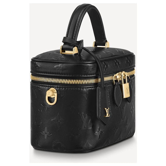 LV Vanity PM crafted in the iconic Monogram coated canvas with a top handle, gold-tone zipper, and a small padlock with box