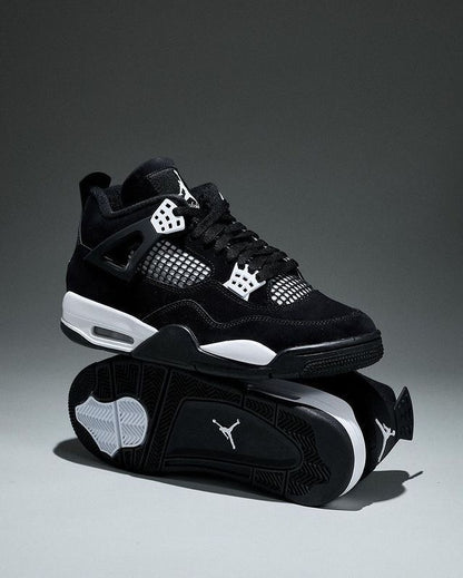 Air Jordan 4 "White Thunder" sneakers, featuring a sleek black nubuck upper contrasted by crisp white mesh accents