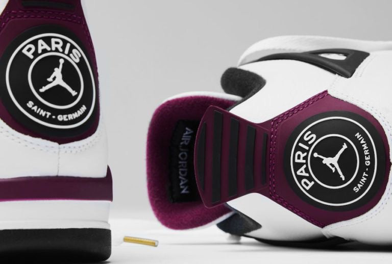 Air Jordan 4 Retro 'Paris Saint-Germain' featuring a distinctive circular PSG crest on the maroon-and-white heel tab