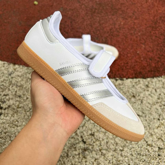 Samba Jane sneaker, featuring a white leather upper with metallic silver stripes and a Mary Jane strap