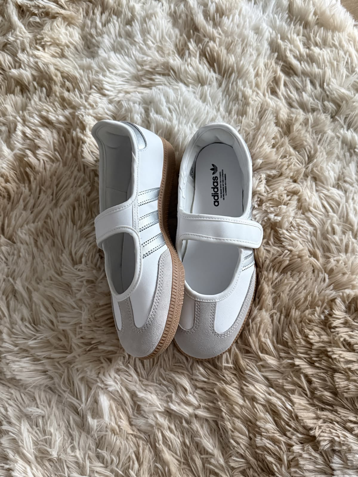 Samba Jane sneaker, featuring a white leather upper with metallic silver stripes and a Mary Jane strap