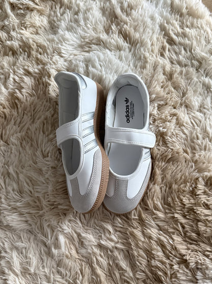 Samba Jane sneaker, featuring a white leather upper with metallic silver stripes and a Mary Jane strap