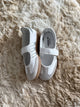 Samba Jane sneaker, featuring a white leather upper with metallic silver stripes and a Mary Jane strap