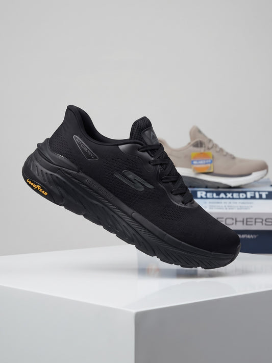 Skechers Max Cushioning athletic shoe featuring bright orange accents and a durable Goodyear rubber outsole