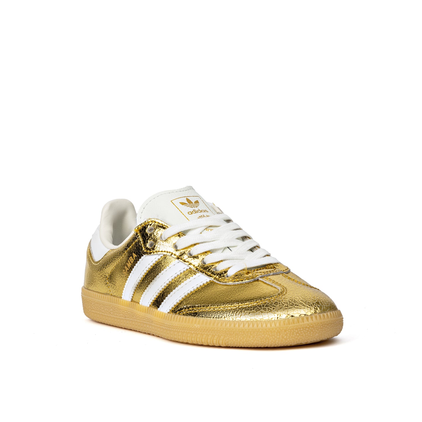 Samba OG sneakers feature a luxurious cracked metallic gold leather upper with white serrated stripes