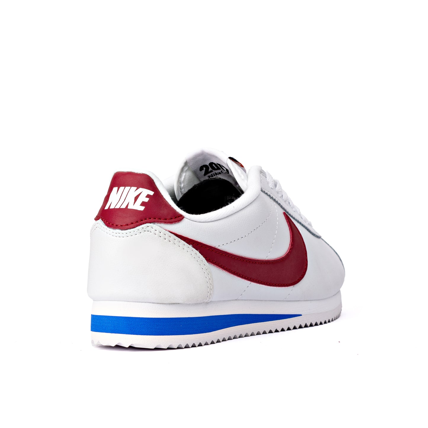 Cortez Forrest Gump sneakers, featuring a white leather upper and signature red swoosh