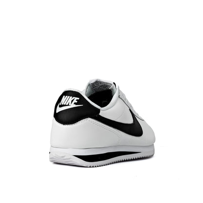 Cortez shoes featuring a classic white leather upper with a contrasting black Swoosh logo
