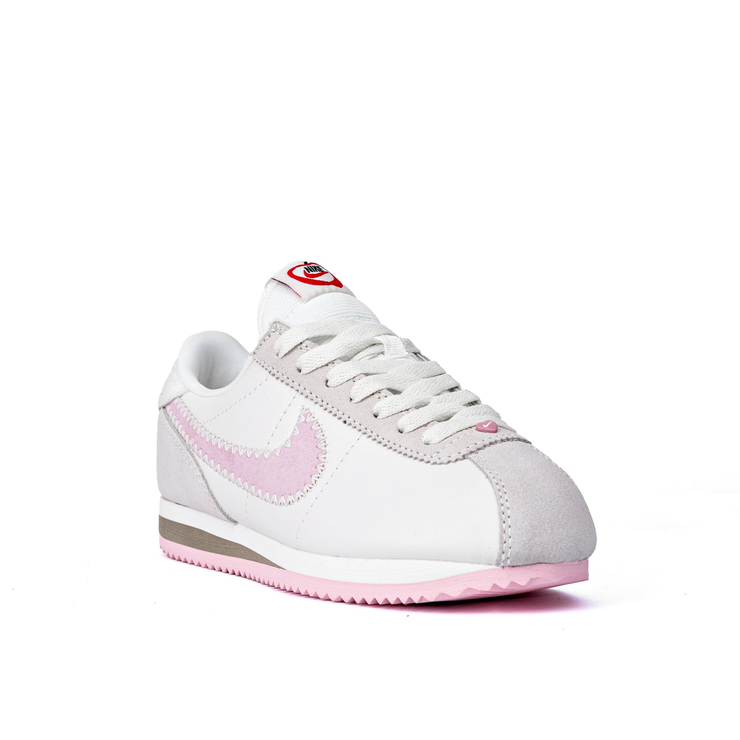 Cortez Valentine's Day sneakers, featuring a white leather upper, pink suede Swooshes, and a special pink heart