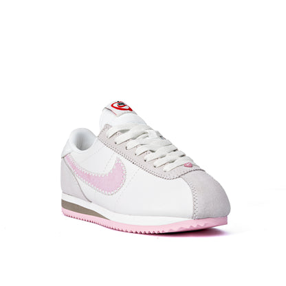 Cortez Valentine's Day sneakers, featuring a white leather upper, pink suede Swooshes, and a special pink heart
