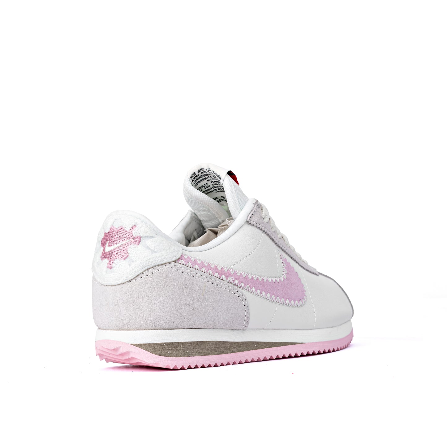 Cortez Valentine's Day sneakers, featuring a white leather upper, pink suede Swooshes, and a special pink heart