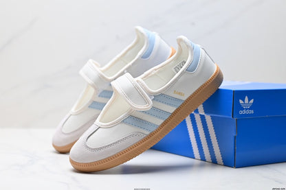 Samba Jane White-sky sneakers feature a distinctive halo blue striped design and a secure hook-and-loop strap