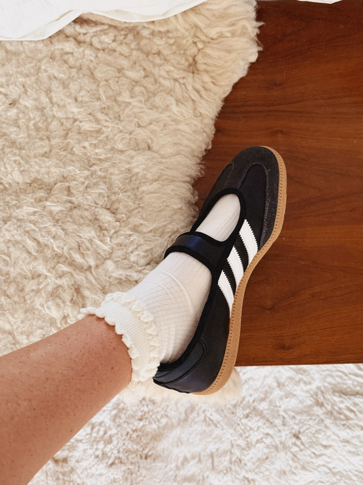 Samba Jane Black shoes feature a classic leather upper and a modern Mary Jane strap aesthetic