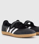 Samba Jane Black shoes feature a classic leather upper and a modern Mary Jane strap aesthetic