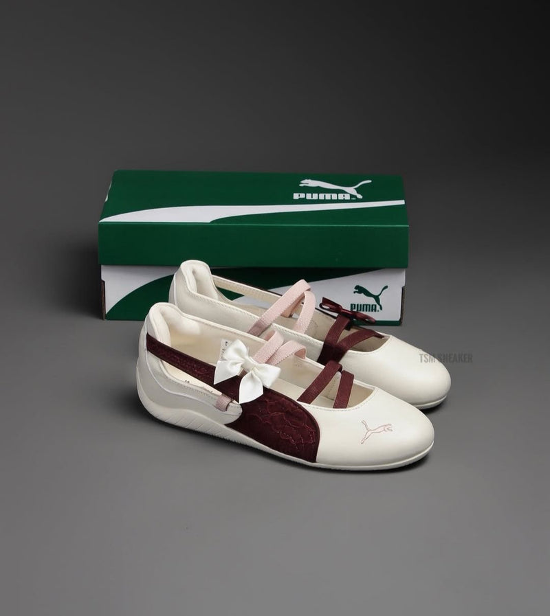 Speedcat Ballet flats featuring a cream body and a maroon shimmer