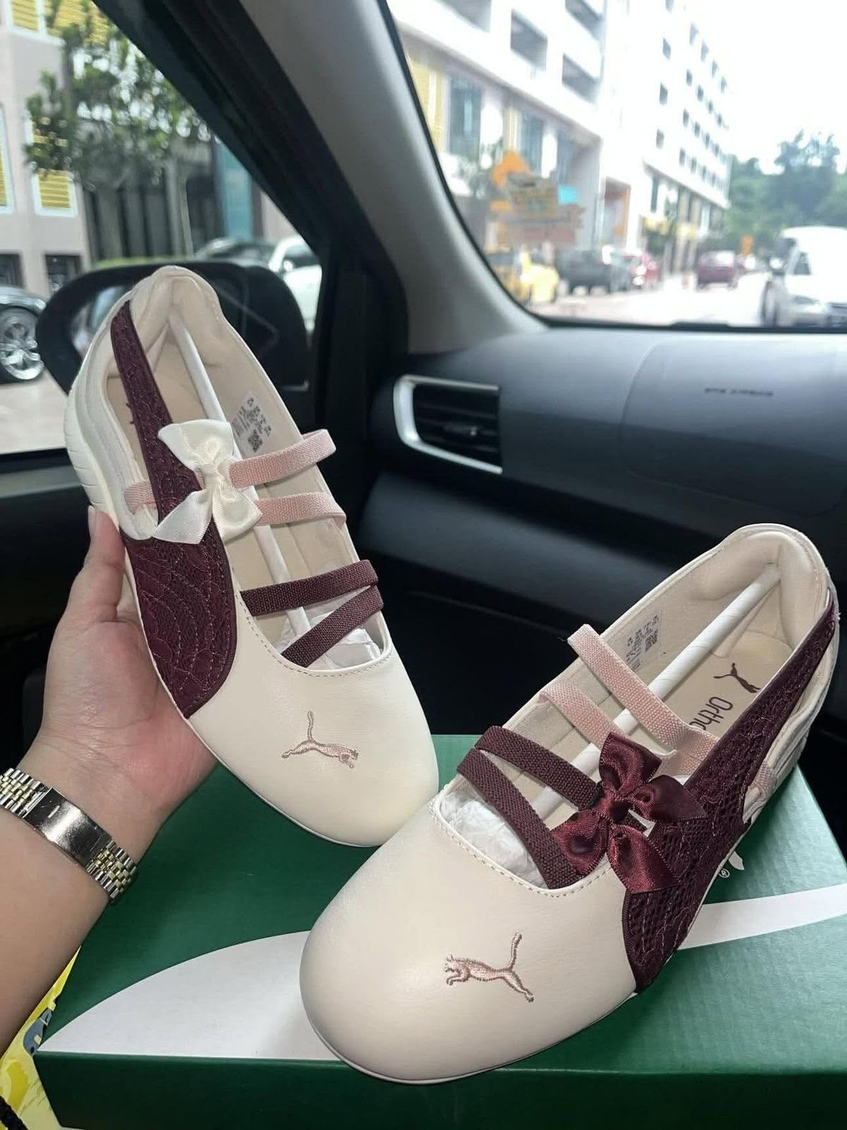 Speedcat Ballet flats featuring a cream body and a maroon shimmer