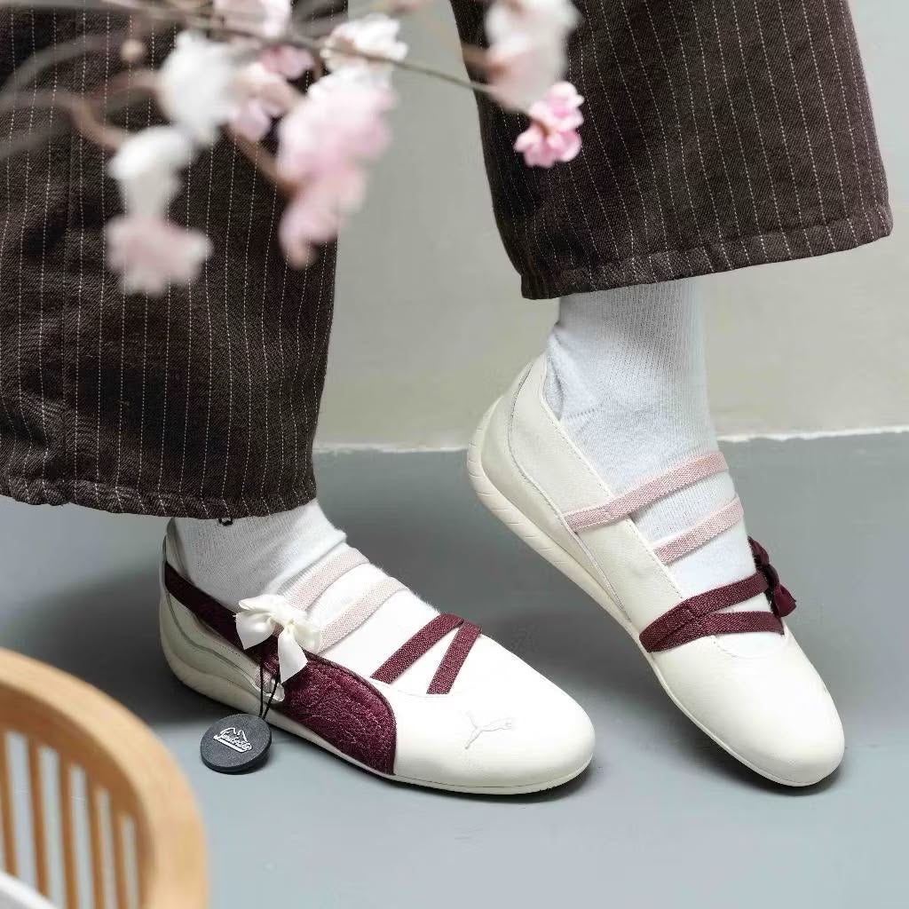 Speedcat Ballet flats featuring a cream body and a maroon shimmer
