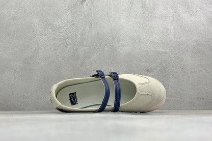 Onitsuka Tiger Mexico 66 TGRS sneakers in a cream and navy colorway with distinctive buckled straps.