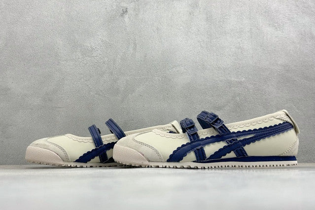 Onitsuka Tiger Mexico 66 TGRS sneakers in a cream and navy colorway with distinctive buckled straps.
