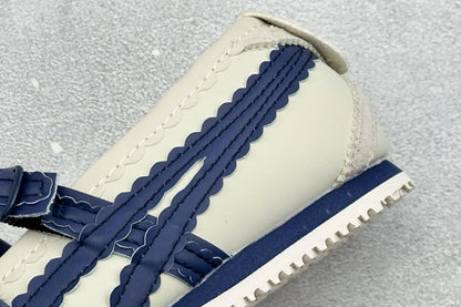 Onitsuka Tiger Mexico 66 TGRS sneakers in a cream and navy colorway with distinctive buckled straps.