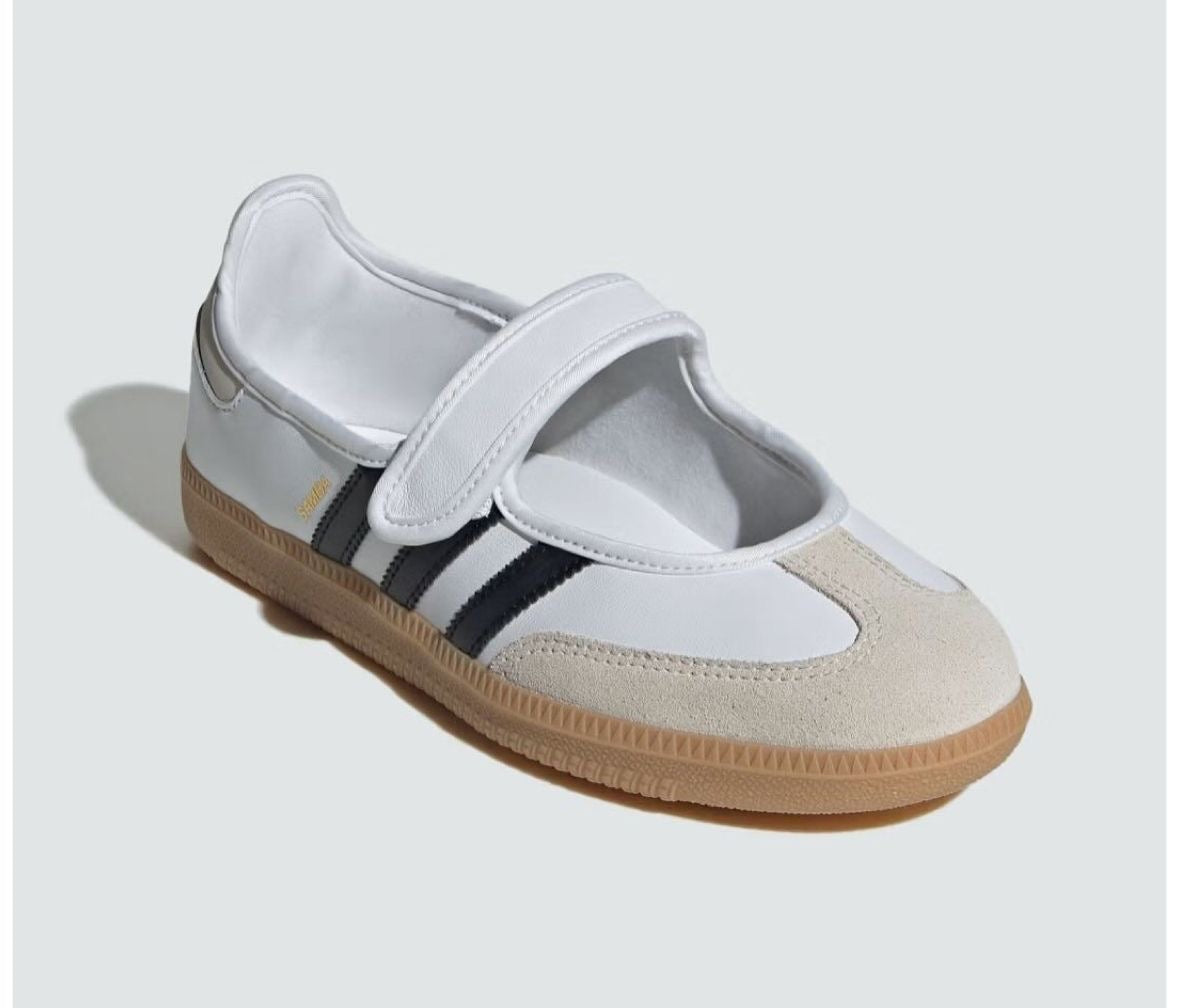 Samba Jane shoes featuring a white leather upper, black stripes, and a velcro strap