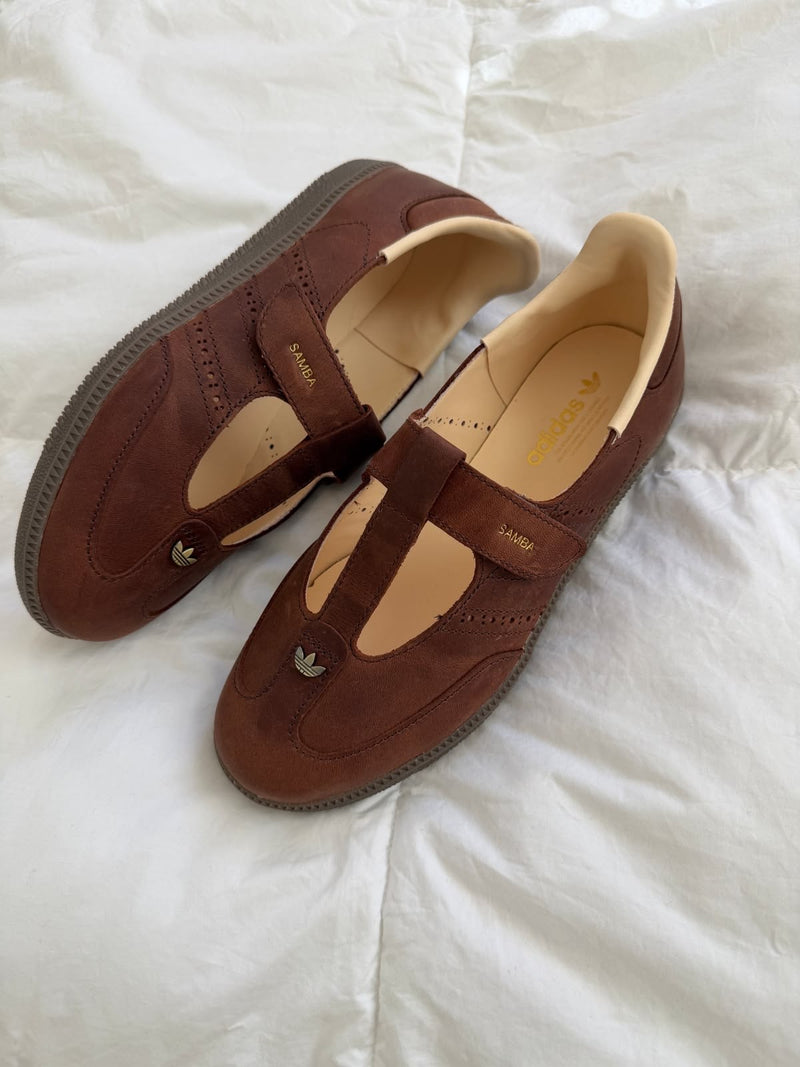 Samba Mary Jane-style strap shoes in a "Brown" or "Sand Strata" colorway, featuring a unique